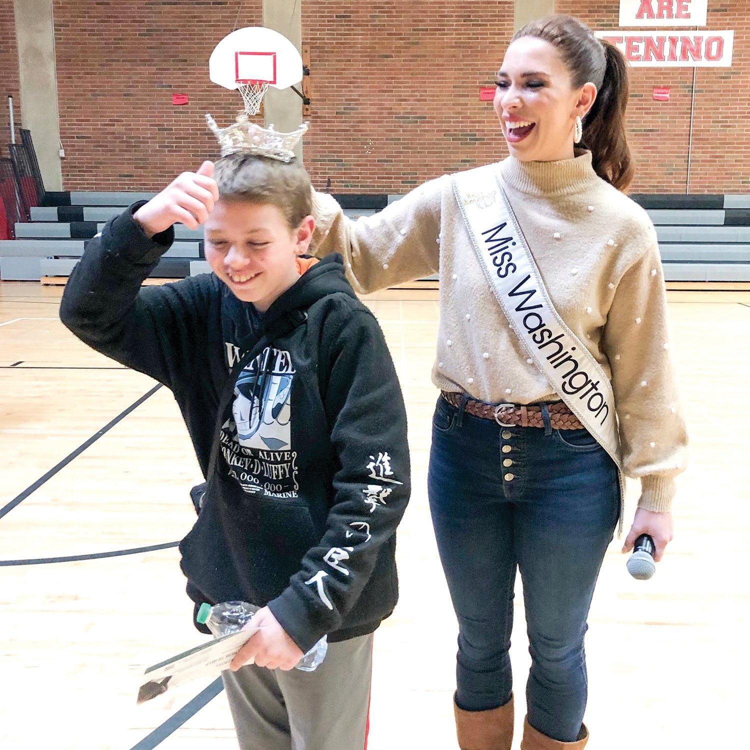 Miss Washington Maddie Louder crowns a student during a visit to the Tenino School District on Tuesday. “A full day at Tenino Middle School talking about stress, anxiety and coping,” she wrote after the event.  “Thanks for having me, Tenino!”